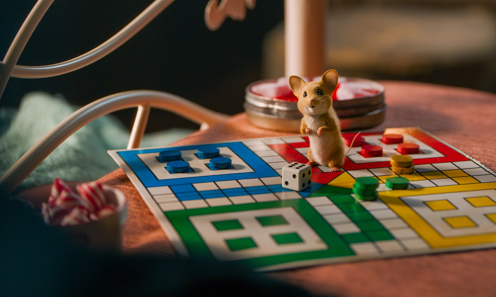 Foto. En animert mus på et ludobrett.